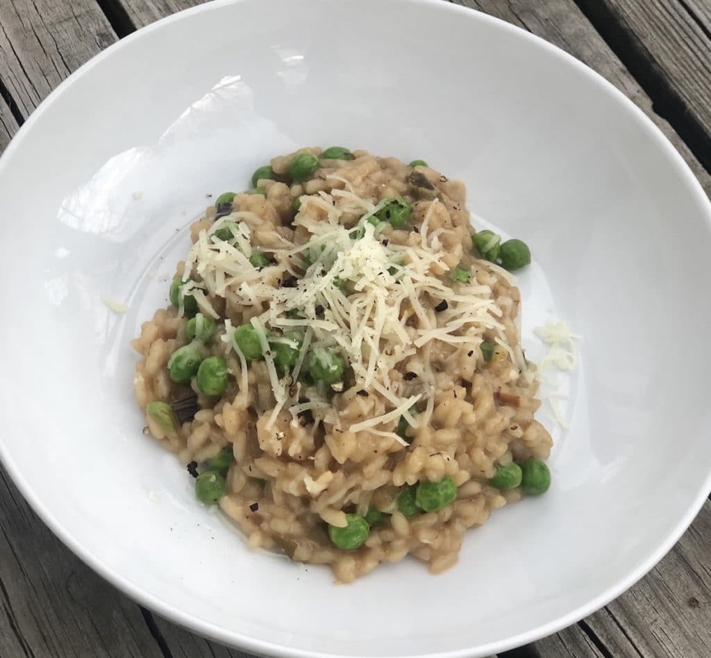 Top this leek and pea risotto recipe with Green Dirt Farm sheep cheese.