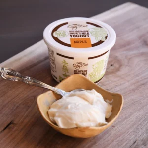 Bowl and tub of maple sheep's milk yogurt