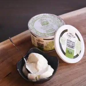 Bowl and tub of plain sheep's milk yogurt